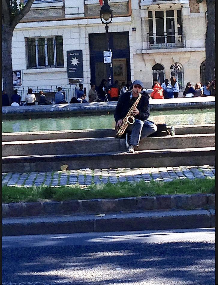 Saxophonist by Canal Saint-Martin Saxophonist by Canal Saint-Martin