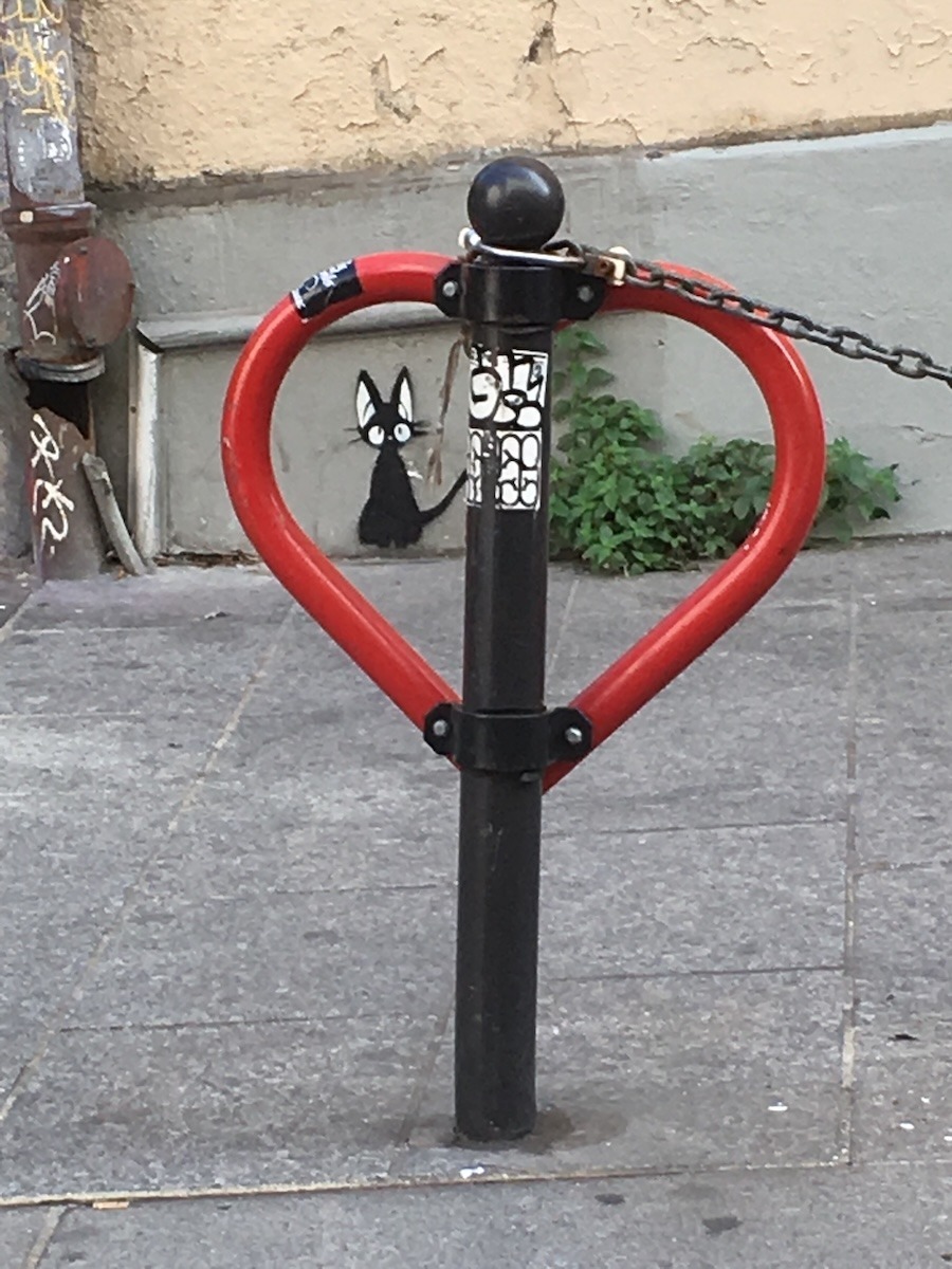 Paris Street Art cat in bollard heart