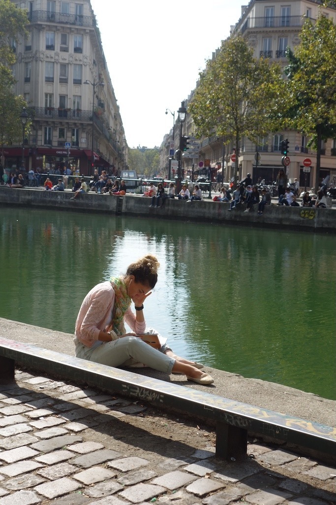 Girl reading by the canal Girl reading by the canal