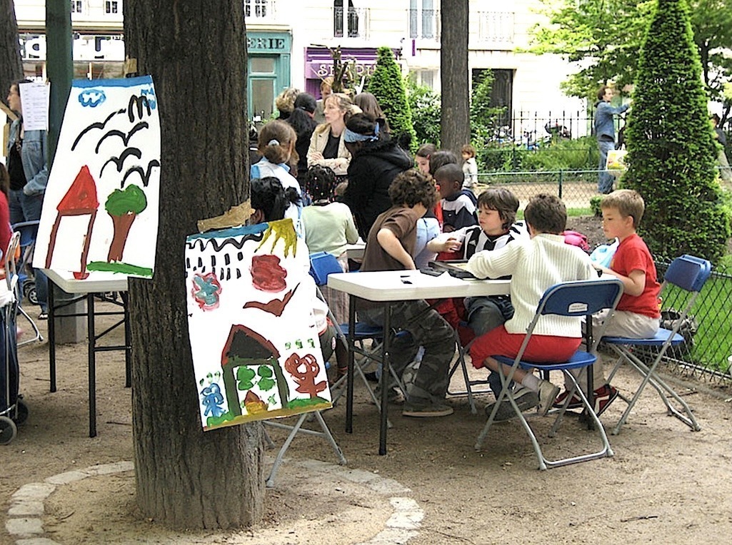 children painting in the park during fête